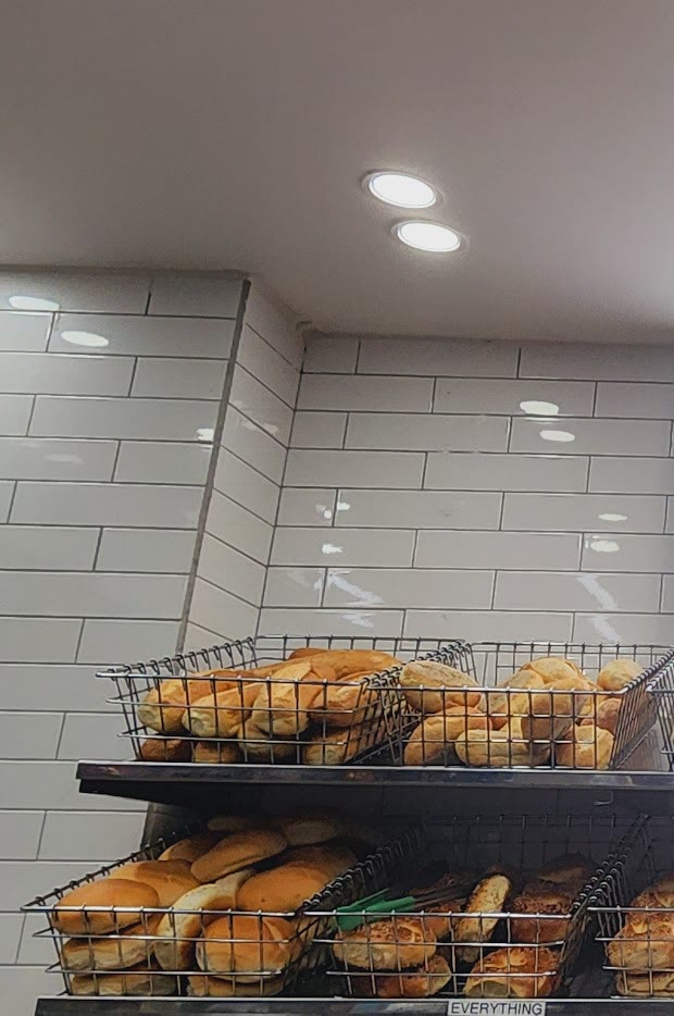 Fresh bagels on the rack at Rocco Bagels