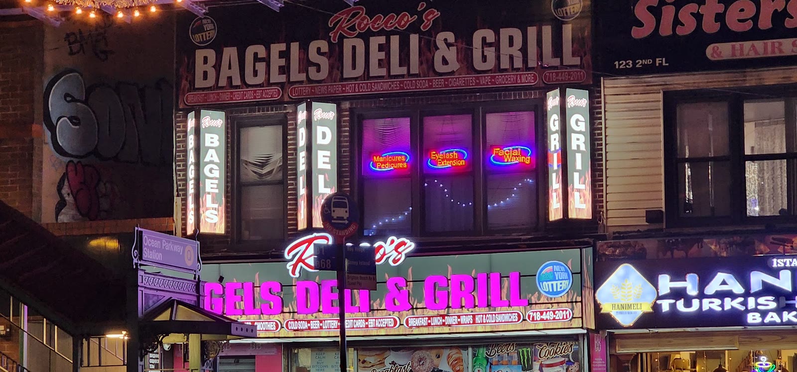Rocco Bagels Deli and Grill lit up at night
