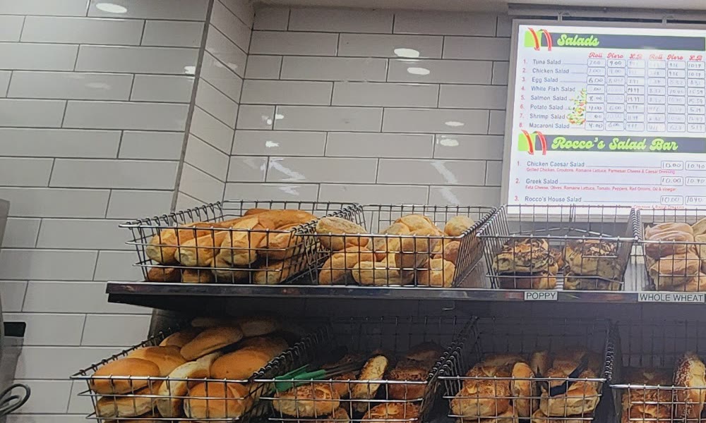 Racks of fresh bagels at Rocco Bagels